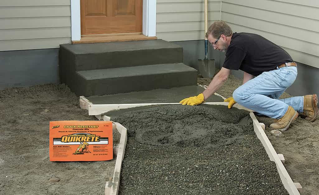 Mixing sand and cement to level the floor