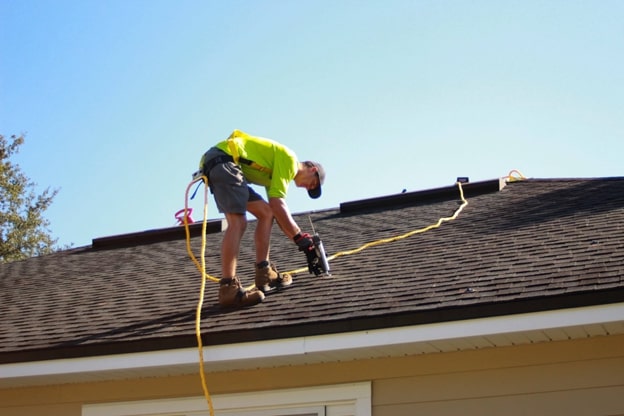a person installing roof